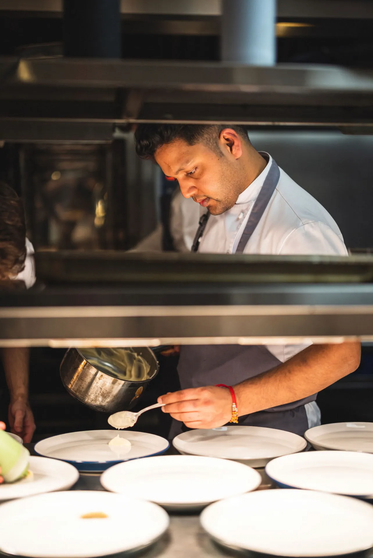 Chef Sagar Massey plating in the Kalinga kitchen